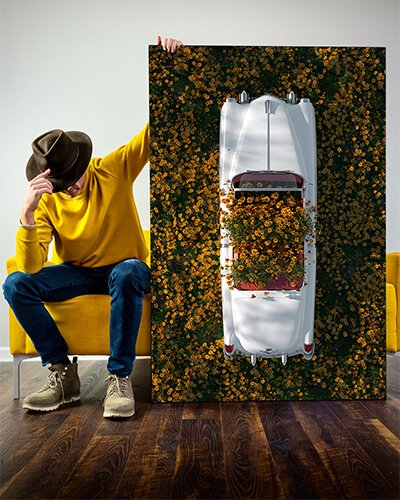 An artist holding a trippy art piece, , as an example of a large wall art trend