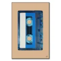Retro blue audio cassette tape with a white and blue label against a tan background.