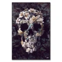 Skull created from white and pale flowers with butterflies and insects against a dark background.