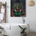 Large surreal bathroom wall art featuring a girl in green with palm fronds for a face hangs in modern white bathroom