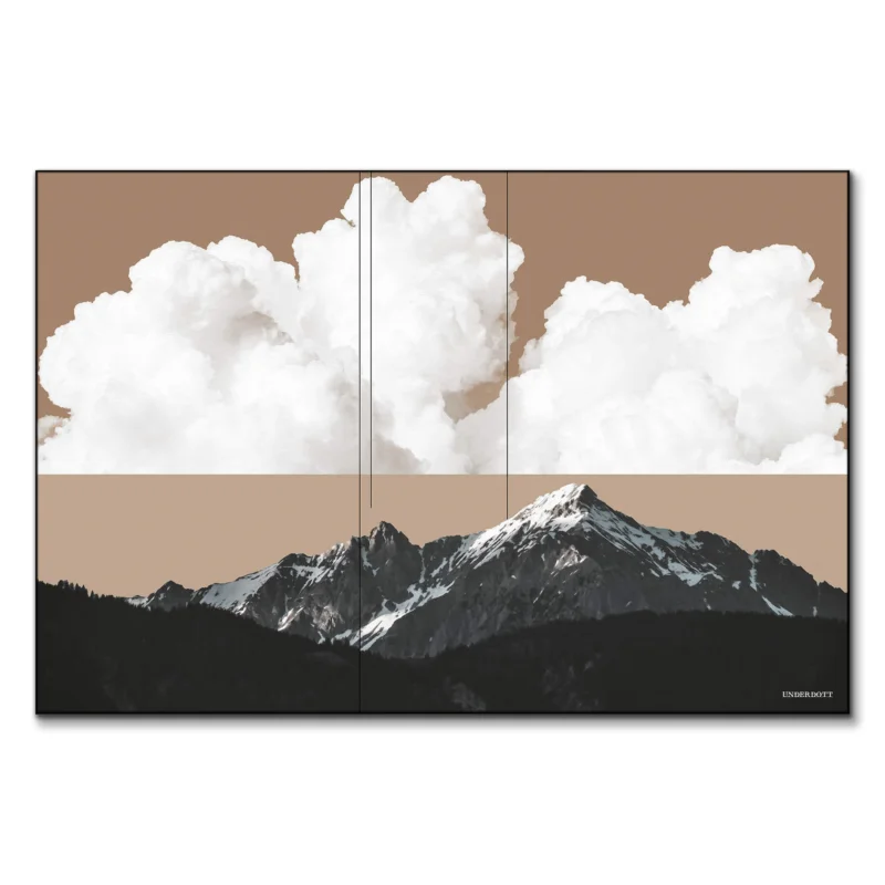 Mountain landscape with a soft tan sky, white clouds, and dark forested peaks, creating a peaceful yet dramatic natural scene.